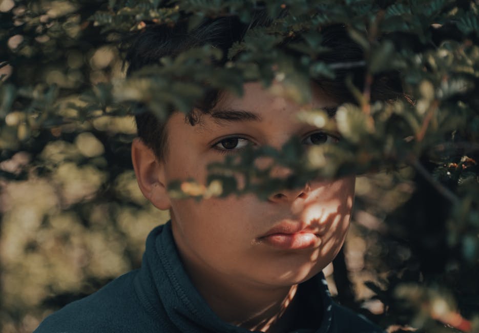 Close-up of a person with eyes closed in quiet meditation, looking peaceful.